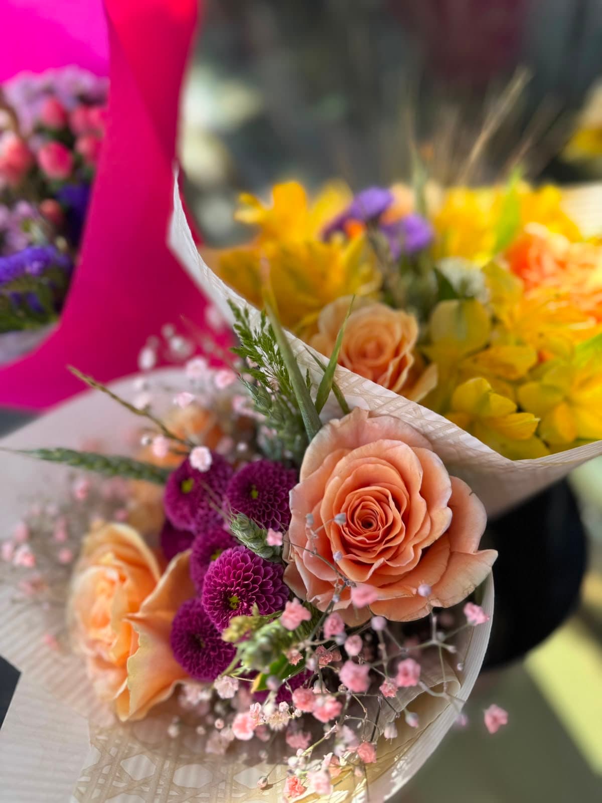 A peach arrangement with yellow roses