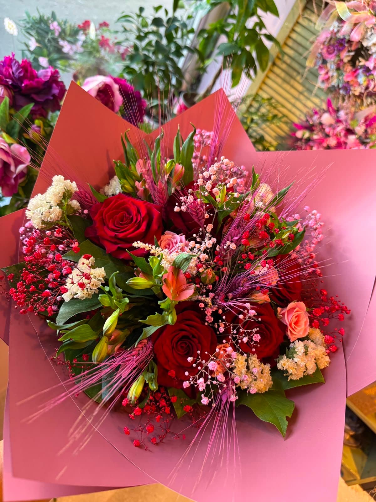 A bouquet in burgundy and white tones